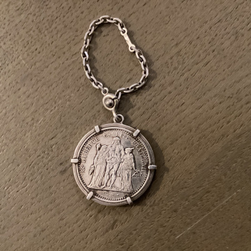 Medaille avec une Piéce de 10 francs